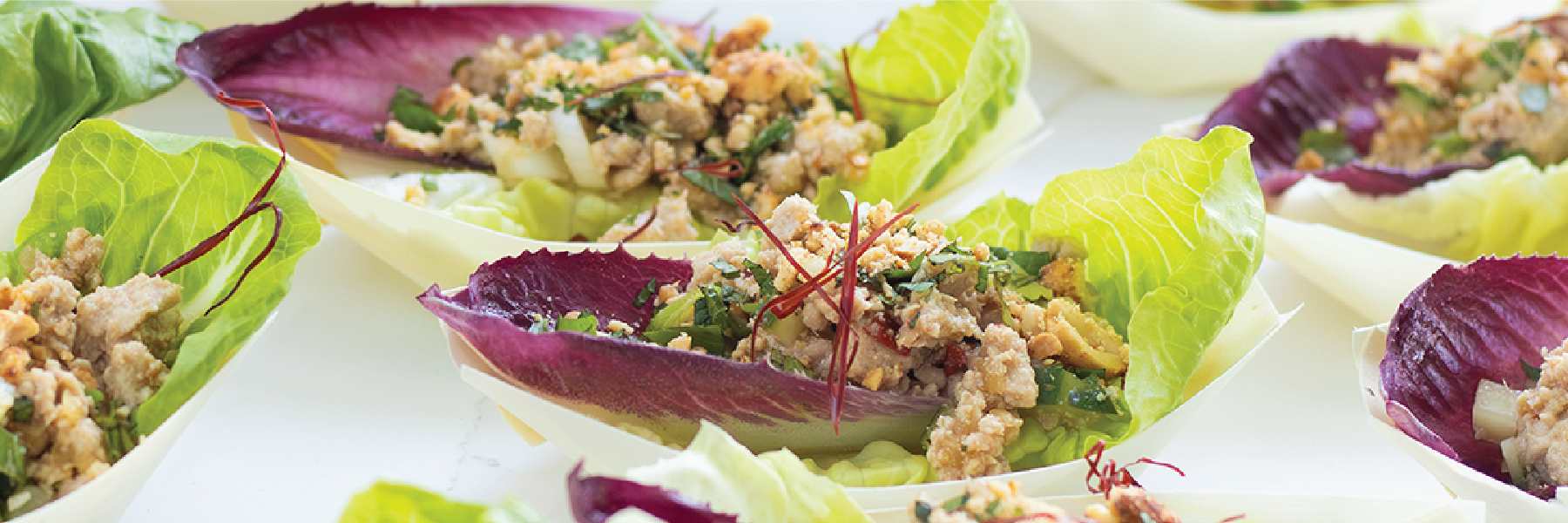 Individual lettuce and radicchio cups filled with a light, herby, pork mixture, the kind of smaller, more considered portions our GLP-1 research is seeing